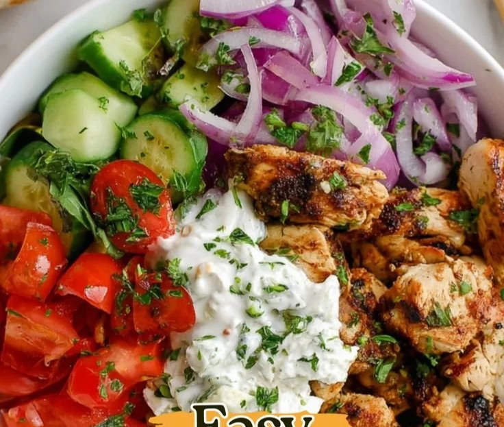 Delicious Chicken Gyro Bowl featuring tender chicken, fresh vegetables, and sauces