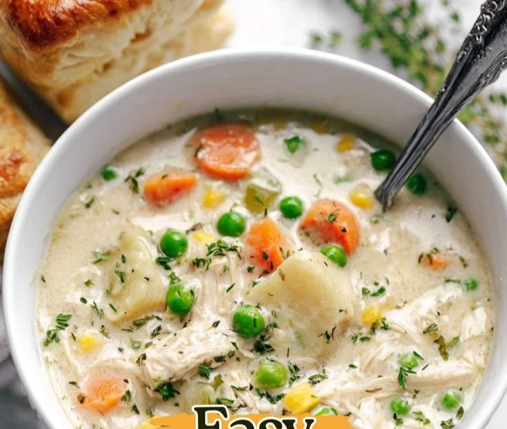 Delicious Chicken Pot Pie Soup served in a warm bowl with fresh herbs.