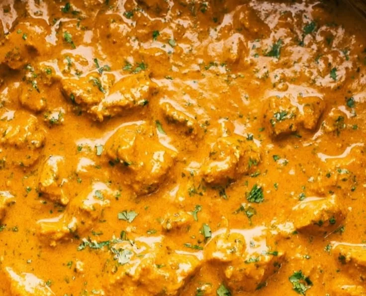Delicious Crockpot Butter Chicken simmering with spices and cream.