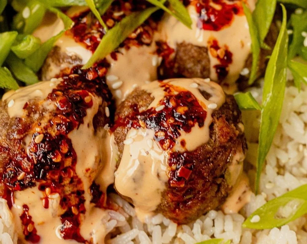 Delicious easy firecracker meatballs served with a tangy sauce