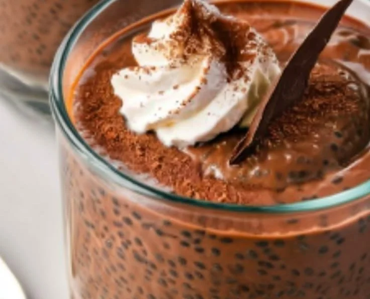 High protein chocolate chia pudding served in a bowl with chocolate sprinkles