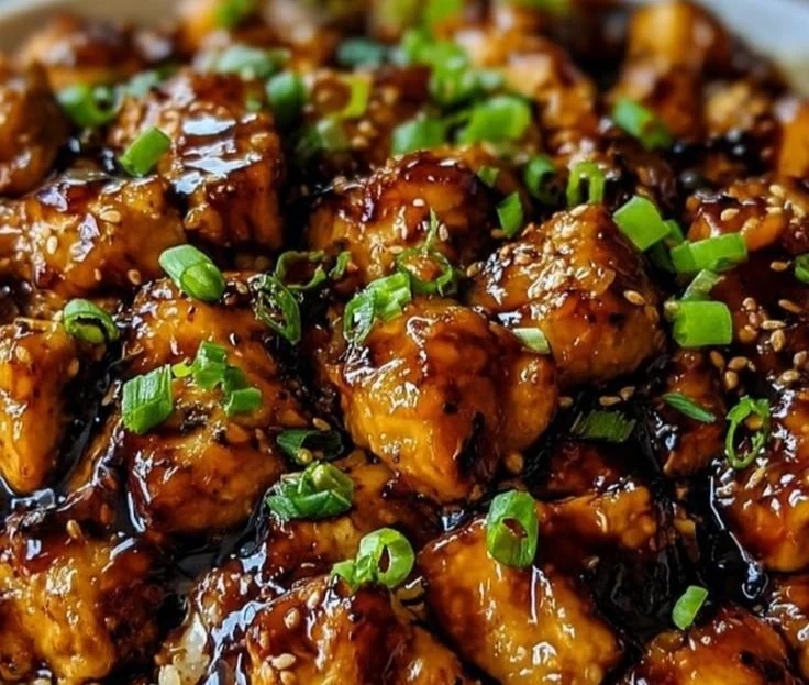 Delicious Honey BBQ Chicken served over rice with colorful vegetables
