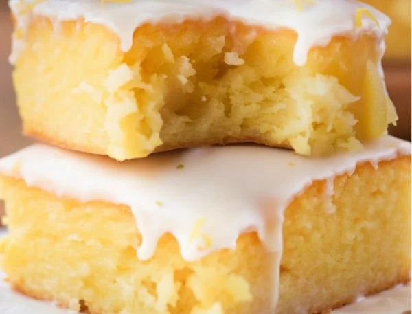 Delicious lemon brownies topped with powdered sugar