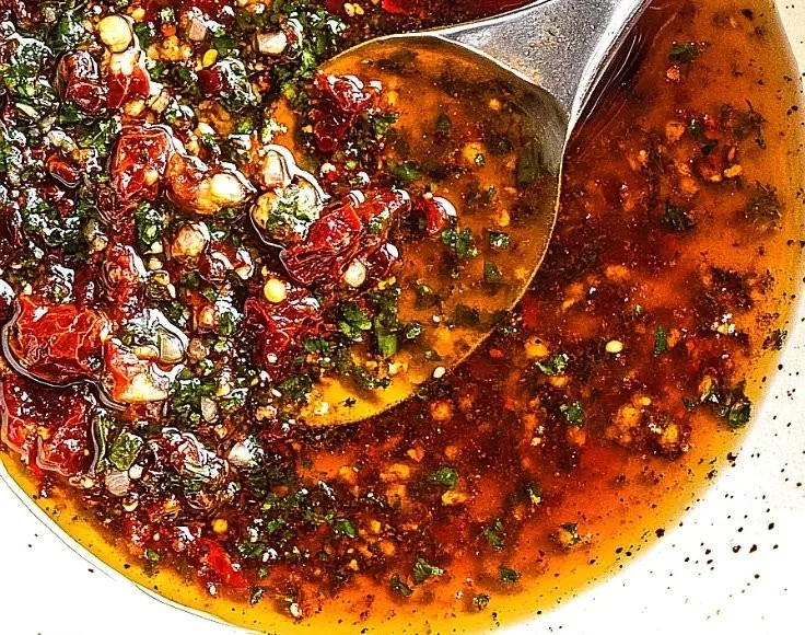 Mediterranean sun dried tomato garlic olive oil dip served with bread