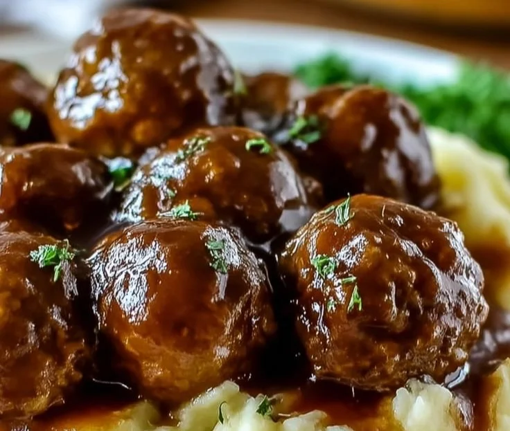 Delicious Slow Cooker Salisbury meatballs served on a plate with gravy