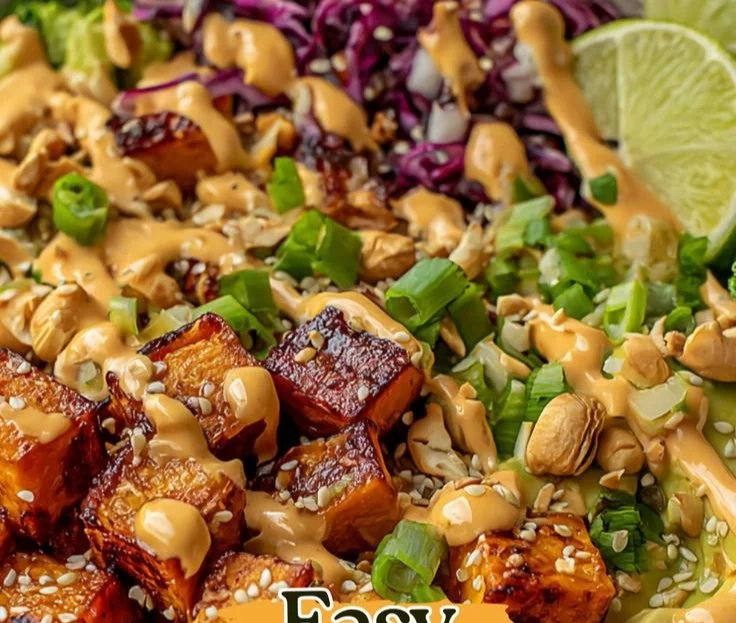 Thai Peanut Sweet Potato Buddha Bowl with fresh vegetables and peanut sauce