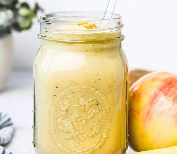 Apple Banana Smoothie in a glass with fresh fruits