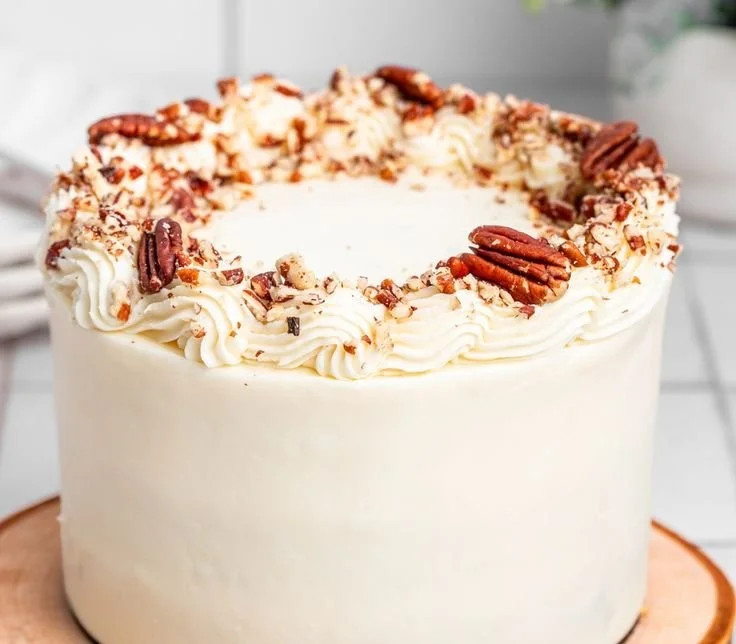 Delicious bakery-style carrot cake topped with cream cheese frosting