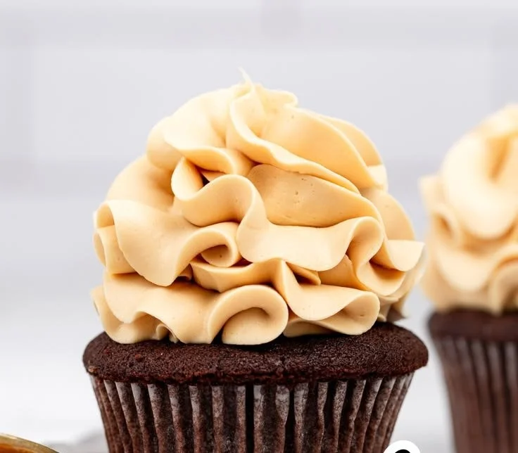 Delicious caramel buttercream frosting topping on a chocolate cupcake
