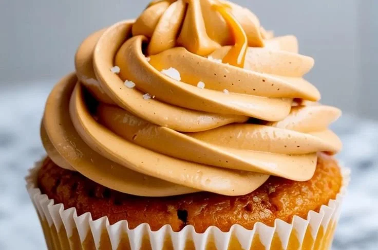Delicious caramel buttercream frosting on a chocolate cupcake.