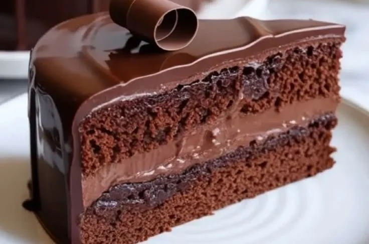 Deliciously moist chocolate cake topped with creamy sour cream frosting