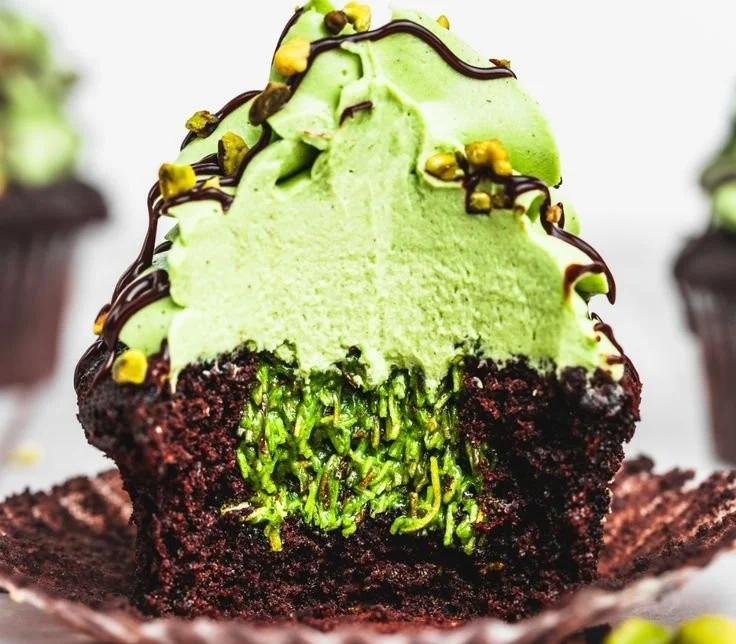 Delicious chocolate pistachio cupcakes with rich frosting and pistachio toppings.