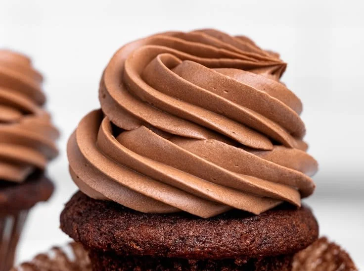 Delicious Chocolate Swiss Meringue Buttercream topping a decadent cake