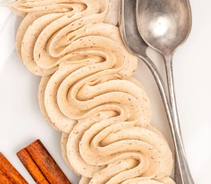 Delicious cinnamon buttercream frosting on a chocolate cupcake