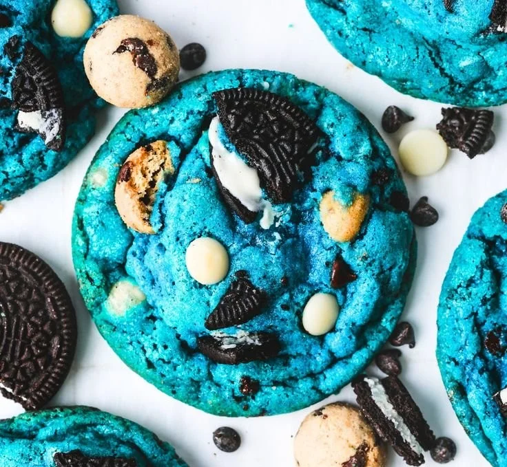 Plate of colorful Cookie Monster Cookies with candies and chocolate chips