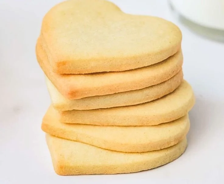 Decorated cut-out sugar cookies on a baking tray