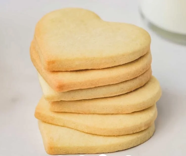 Colorful decorated sugar cookies arranged beautifully on a plate