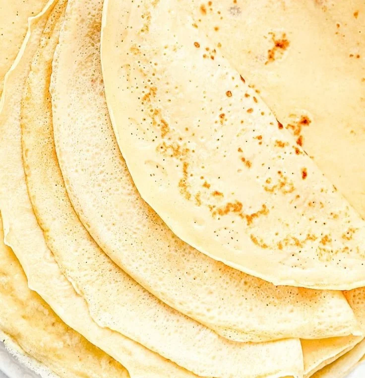 Delicious easy French crepes served with fresh fruits and syrup
