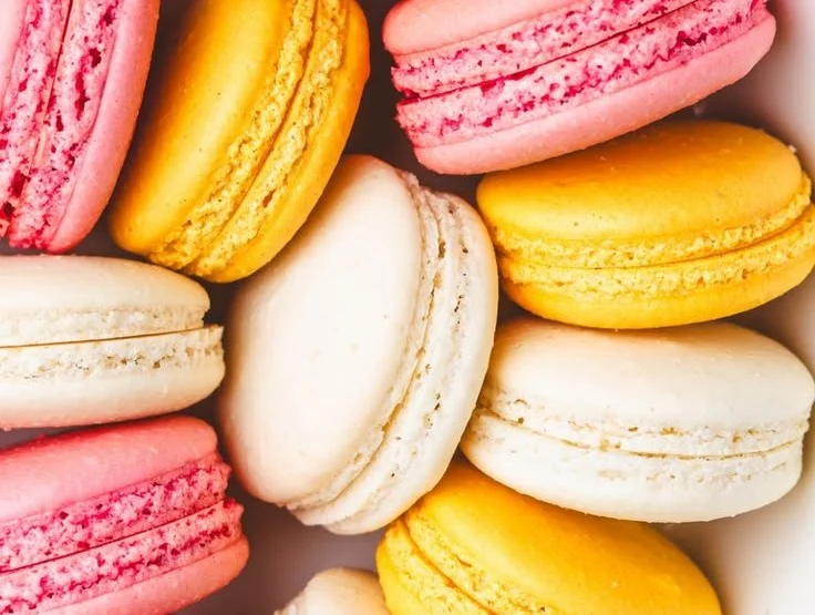 A vibrant display of assorted French Macarons in different flavors and colors.
