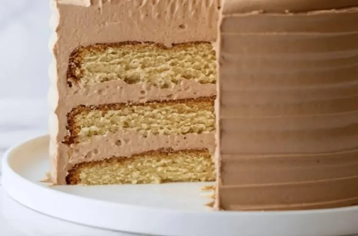 Kahlua buttercream cake filling swirled on a decadent chocolate cake
