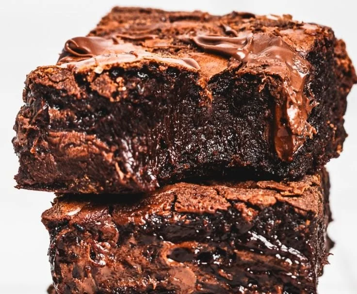 Decadent Nutella brownies topped with chocolate drizzles