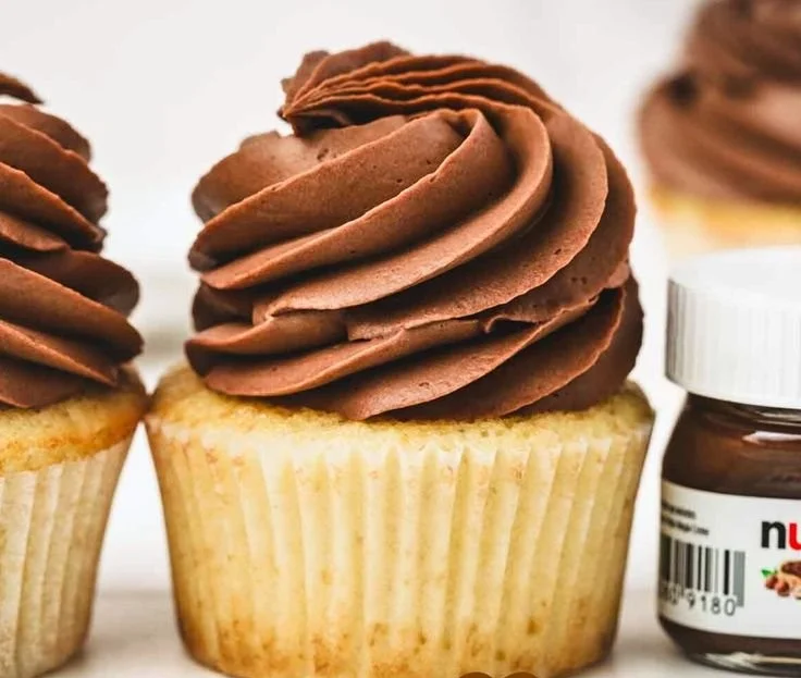 Delicious Nutella ganache frosting drizzled over a chocolate cake