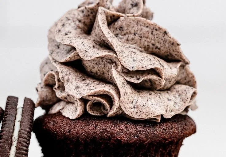 Delicious Oreo Frosting spread on chocolate cupcakes