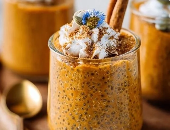 Delicious pumpkin chia pudding topped with spices and nuts in a bowl