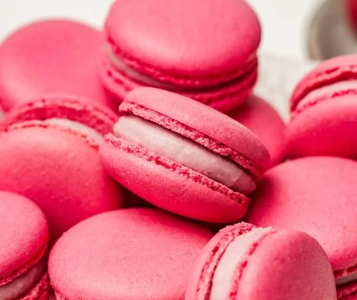 Plate of beautiful pink Raspberry Macarons arranged elegantly