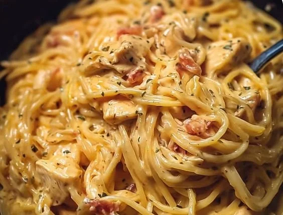 Delicious slow cooker cheesy chicken spaghetti served in a bowl