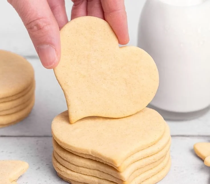 Baking delicious homemade sugar cookies on a decorated plate.