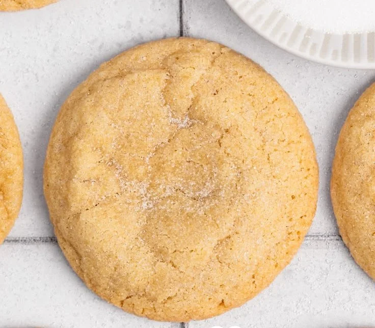 Freshly baked vanilla sugar cookies on a white plate