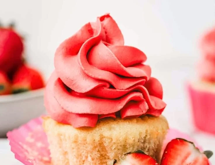 Delicious whipped strawberry ganache topping on a cake