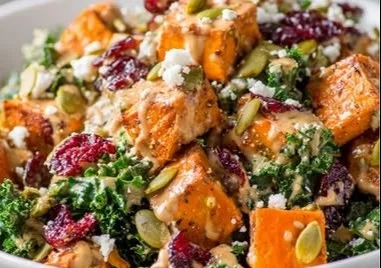 Almond Butter-Dressed Sweet Potato Kale Salad with vibrant vegetables and dressing