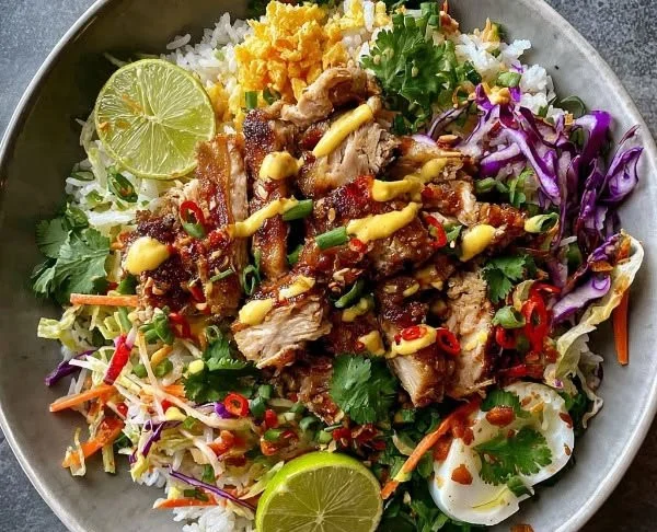 Bang Bang Chicken Crispy Rice Salad garnished with fresh vegetables