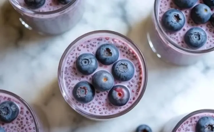 Delicious blueberry chia seed pudding topped with fresh blueberries and mint.