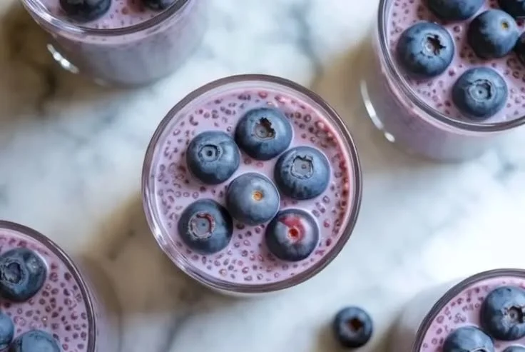 Delicious blueberry chia seed pudding served in a bowl with fresh blueberries on top.