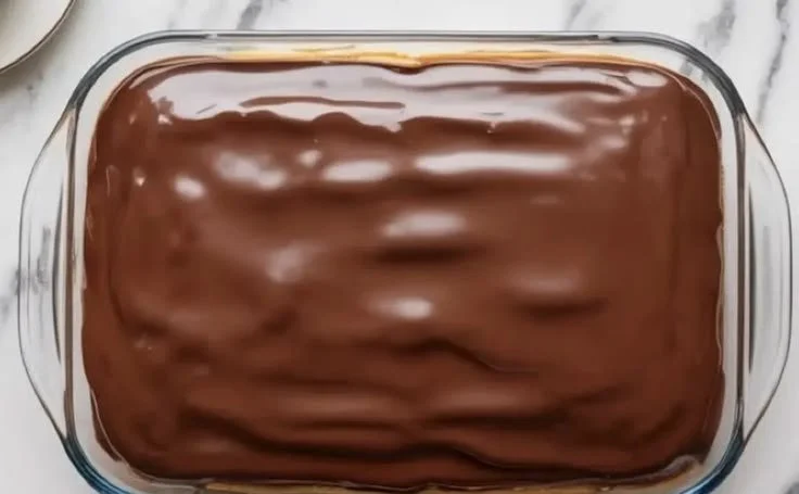 Delicious Boston Cream Pie Poke Cake served on a plate