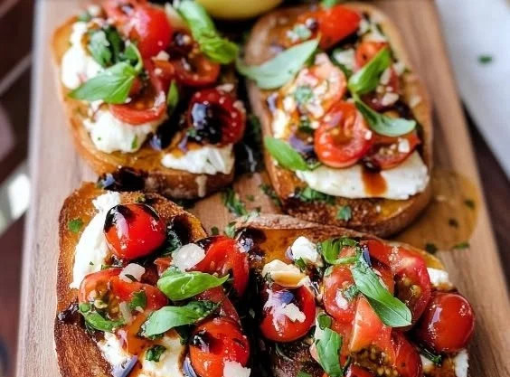 Delicious Bruschetta with creamy Burrata cheese topped with fresh tomatoes.