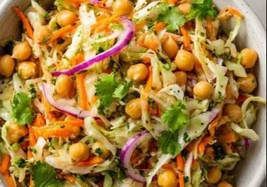 Cabbage Chickpea Salad with Carrot and Lime served in a vibrant bowl