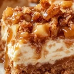 Delicious caramel apple cheesecake bars on a white plate