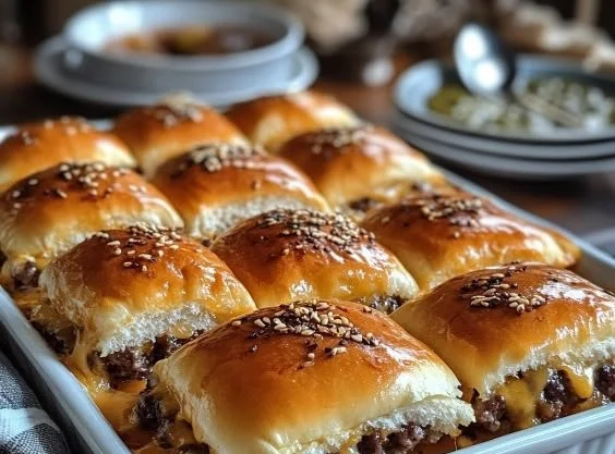 Cheeseburger sliders on sweet Hawaiian rolls, perfect for gatherings and parties.