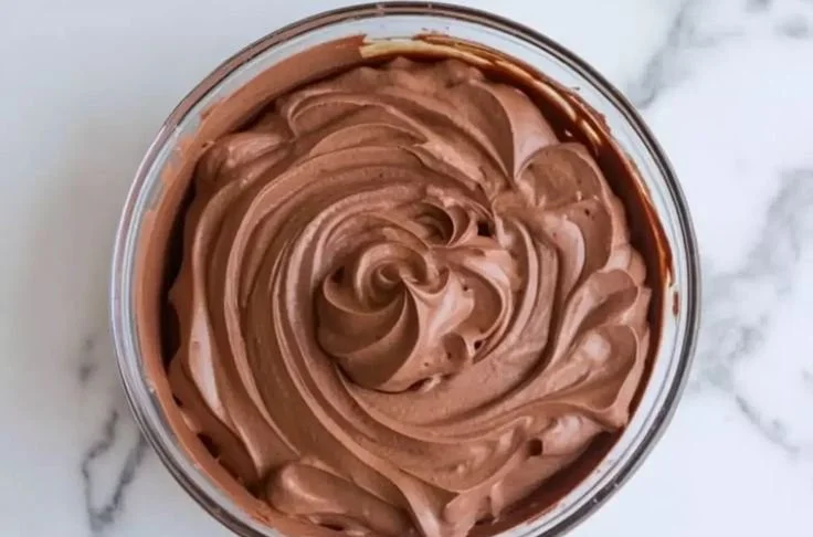 Delicious chocolate mousse cake filling made with rich chocolate and cream.