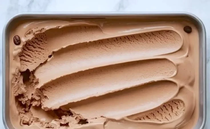 Delicious coffee ice cream in a bowl decorated with coffee beans