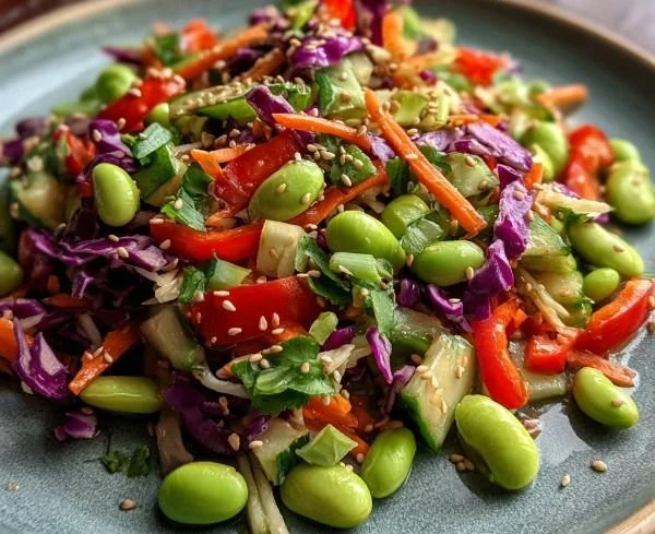 Delicious Crunchy Asian Edamame Salad with colorful veggies and sesame dressing.