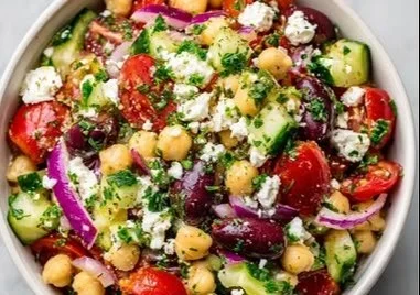 Delicious Greek Chickpea Salad with fresh vegetables and feta cheese