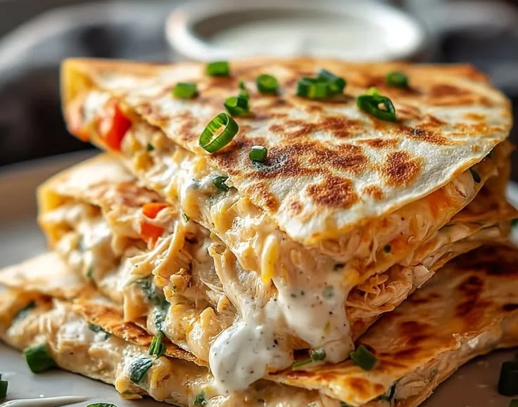 High-protein chicken ranch quesadilla with melted cheese and fresh toppings
