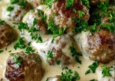 Homemade Swedish meatballs served in creamy sauce.