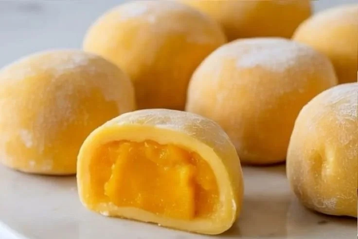 Delicious Mango Mochi dessert with mango-flavored glutinous rice coating.
