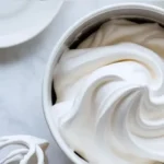 Delicious homemade Marshmallow Frosting topping on a cake